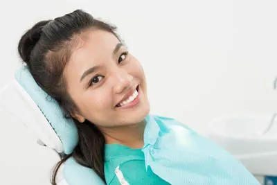 patient smiling after getting her teeth whitened at Holt Dental in Fishers, IN