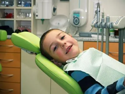 young patient smiling while in the dental chair