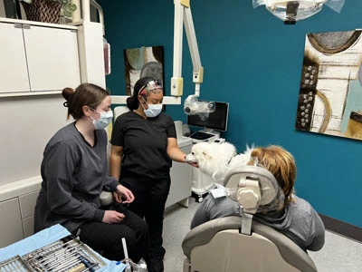 Holt Dental team discussing gum disease treatment options with a patient